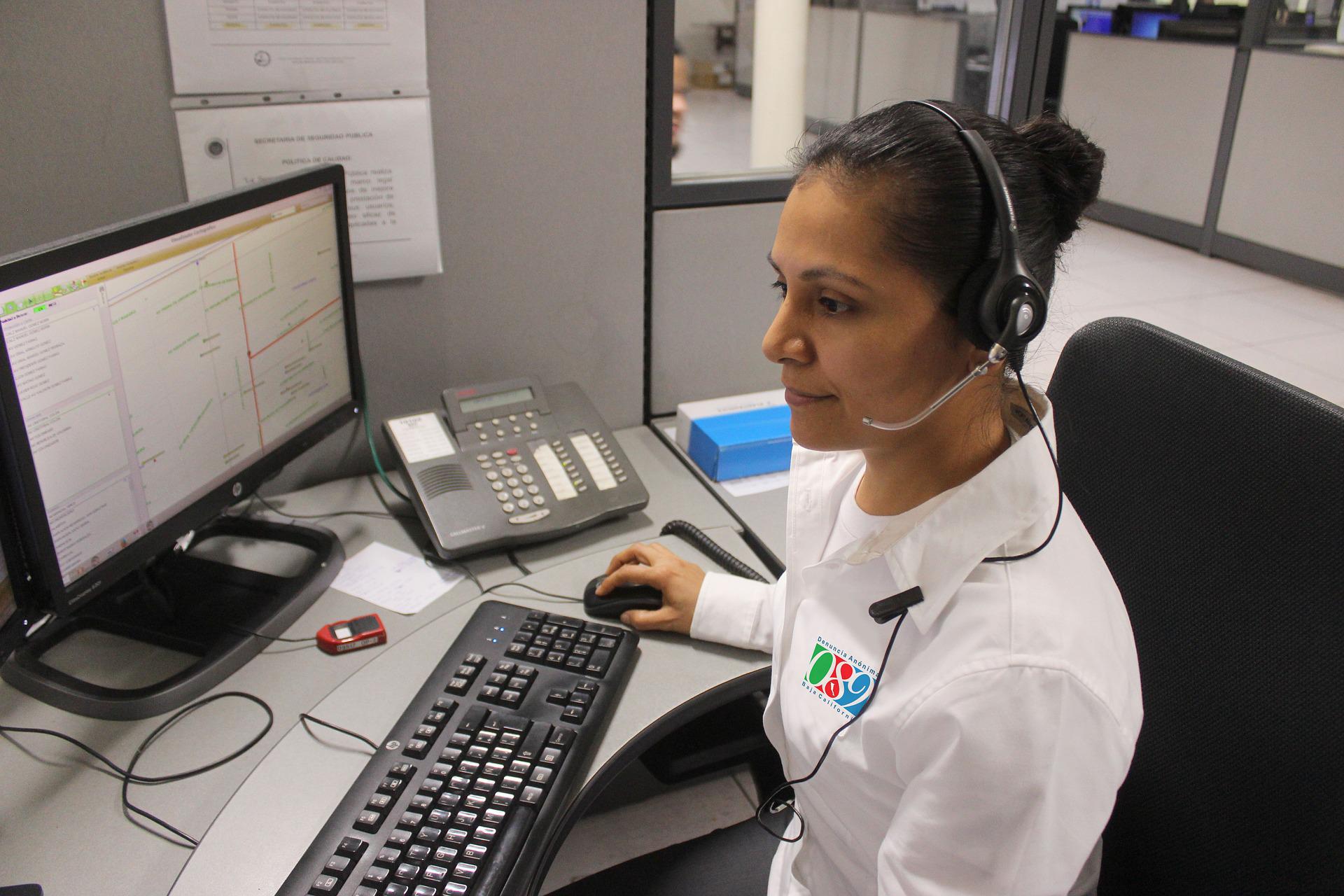 woman at 911 call center